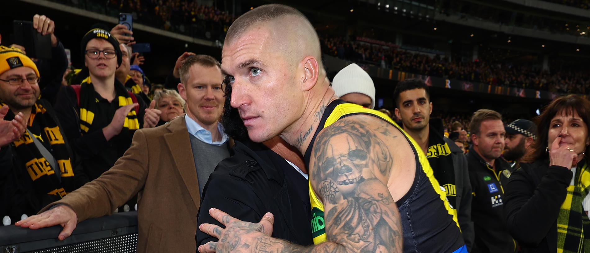 MELBOURNE, AUSTRALIA - JUNE 15: Dustin Martin of the Tigers embraces his agent Ralph Carr following his 300th match the round 14 AFL match between Richmond Tigers and Hawthorn Hawks at Melbourne Cricket Ground on June 15, 2024 in Melbourne, Australia. (Photo by Graham Denholm/Getty Images)