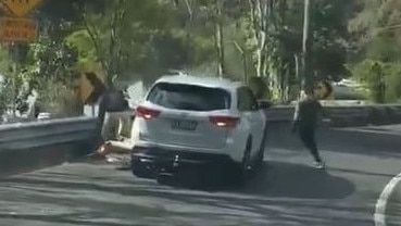 Dashcam footage captured the moment two men allegedly assaulted a man then tried to steal his motorbike near Wollongong.