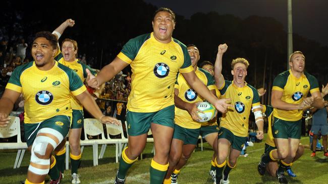 The Australian bench celebrates a historic win over New Zealand Under 20s. Picture: Richard Gosling