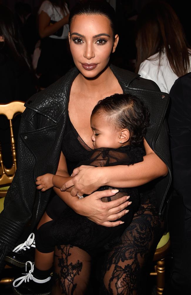 Nap time? Kim Kardashian and North West attend the Givenchy show in Paris, France. Photo by Pascal Le Segretain.