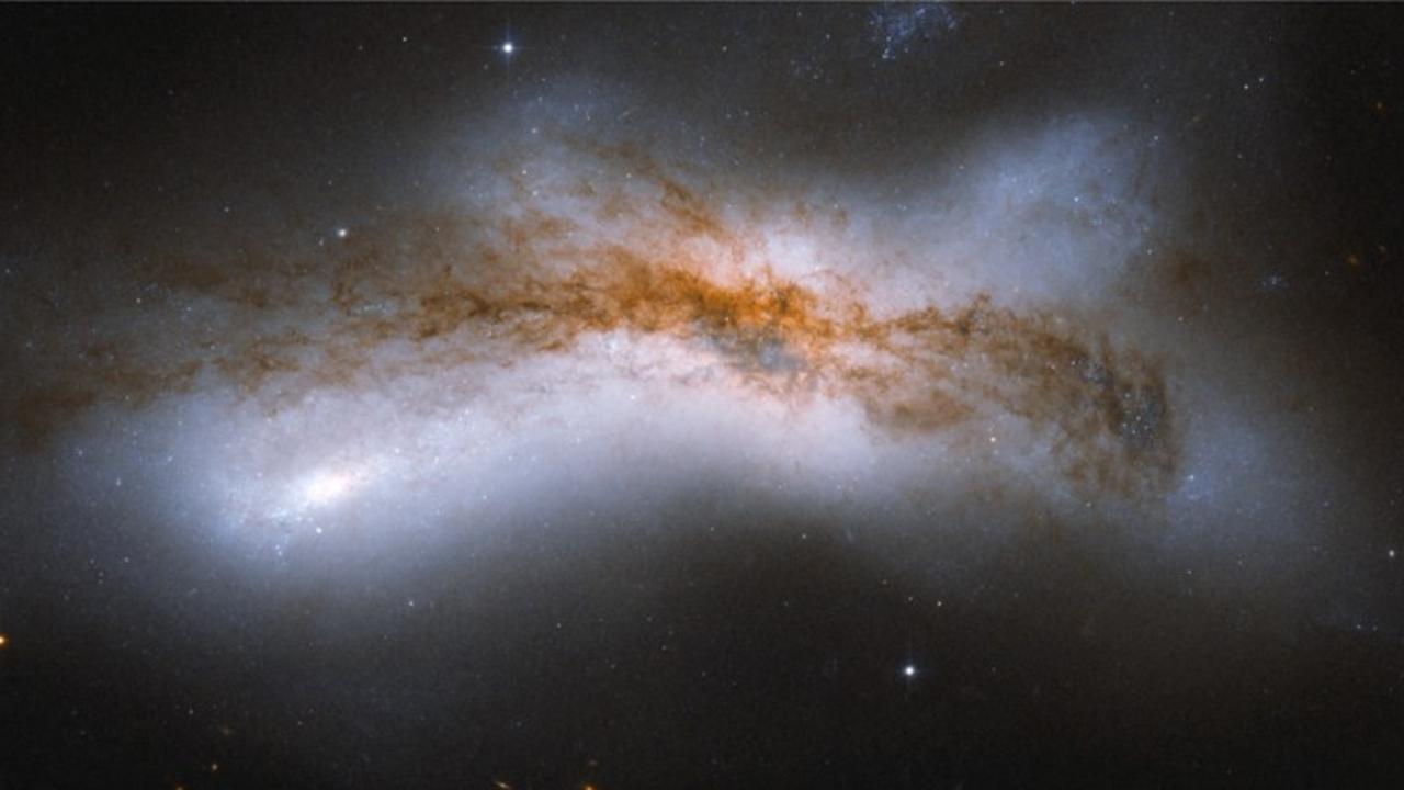 Or a 100,000 light-year separation leads to a collision. Photo by Handout / NASA/ESA / AFP