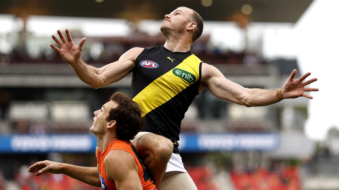 Richmond's Kamdyn McIntosh flies high over Jack Buckley at Giants Stadium. Picture: Phil Hillyard