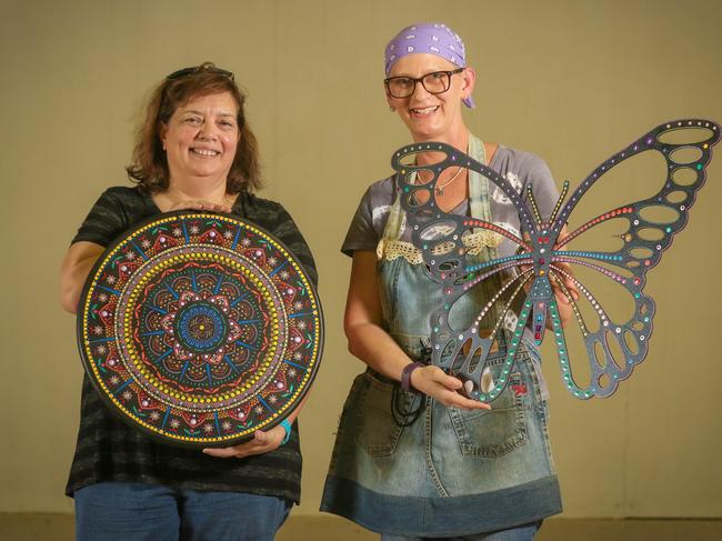 Jenny Majid gets her Folk Art entries in to steward Susan Sinclair before the 70th Royal Darwin Show on this weekend. Picture: Glenn Campbell