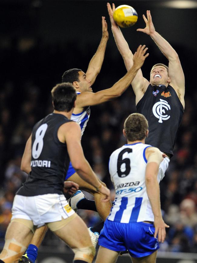 Bryce Gibbs soars for a mark for Carlton.