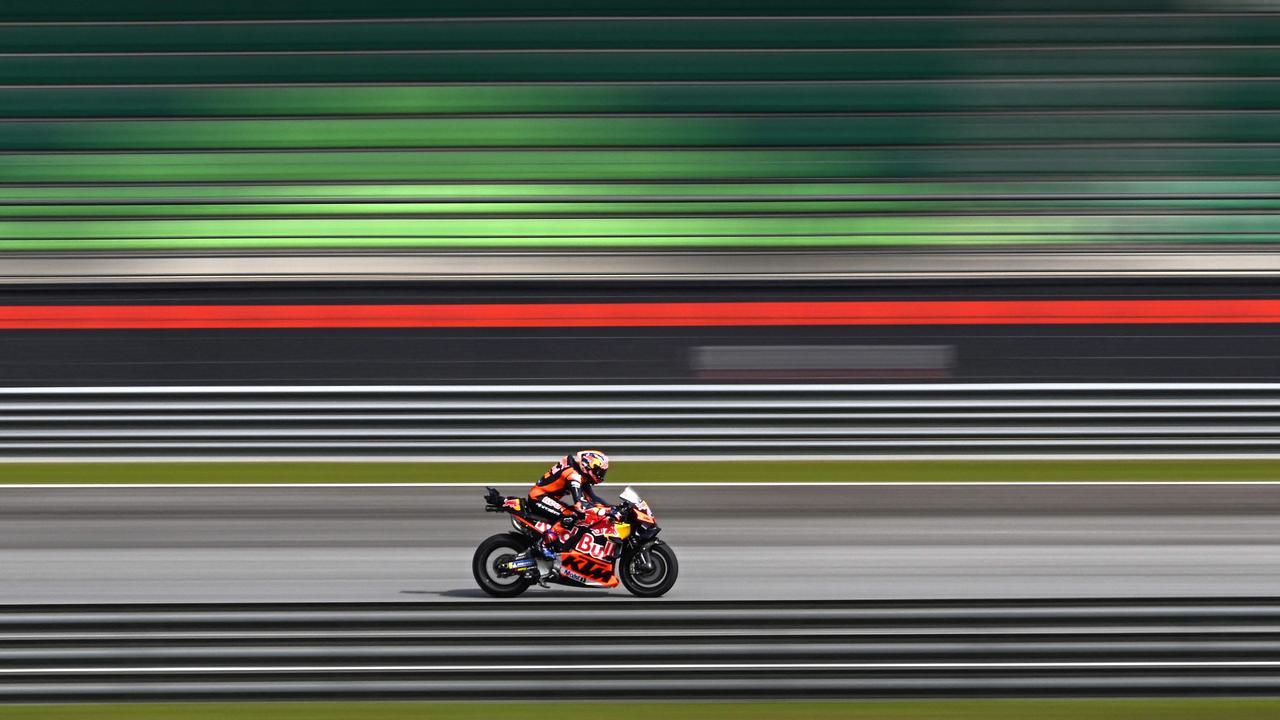 (FILES) Red Bull KTM Factory Racing Jack Miller steers his bike during the second day of the pre-season MotoGP test at the Sepang International Circuit in Sepang on February 7, 2024. Formula One owners Liberty Media swooped to buy MotoGP on April 1, 2024 in a deal valued at around $4.5 billion, the American company announced. MotoGP said in a statement that Liberty Media would acquire "approximately 86 percent" stake from owners Dorna in a deal valued at 4.2 billion euros ($4.5 billion). (Photo by Mohd RASFAN / AFP)