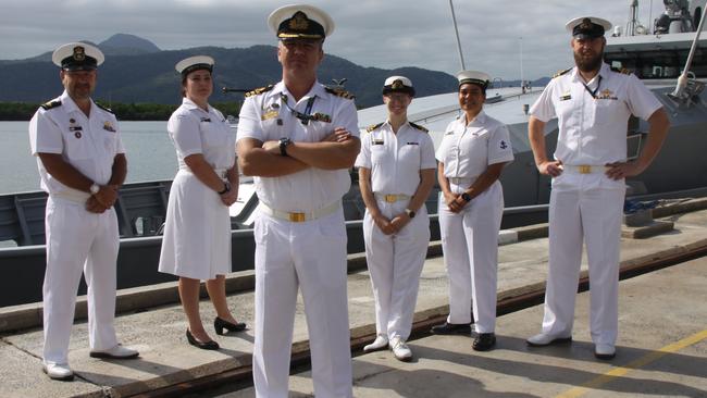 HMAS Cairns Commanding officer Alphonso Santos (centre) with some of his staff at HMAS Cairns who were on hand to chat with their US Coast Guard colleagues. Picture: Alison Paterson