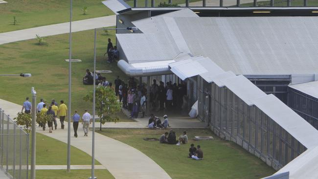 NEWS - A group arrive at the North West Point detention centre, including Police and Interpreters, to interview the survivors of Thursday's crash.