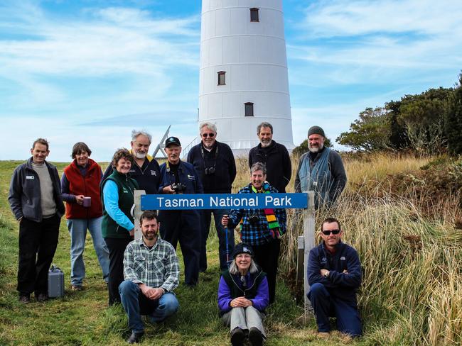 Wildcare Friends of Tasman Island volunteer group with staff from the Parks and Wildlife Service and Australian Maritime Safety Authority, after a successful working bee on the island. Picture: Erika Shankley.