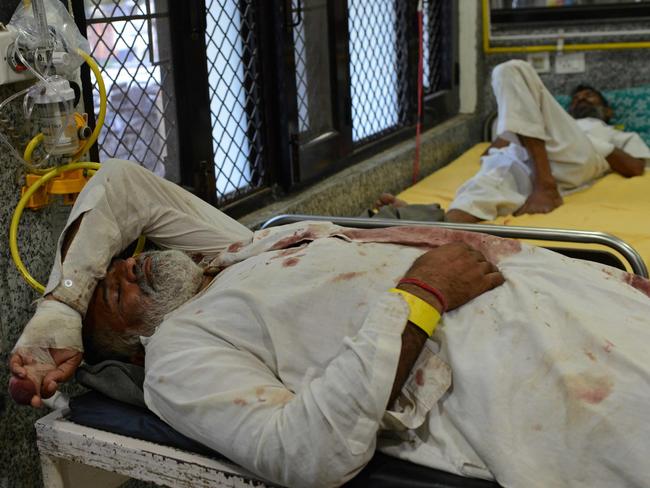 Injured followers of religious leader Gurmeet Ram Rahim Singh receive treatment at the civil hospital in Panchkula. Picture: AFP