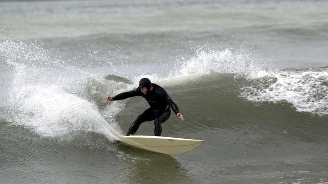 Surfer Mark Fleming from Lauderdale surfing at Seven Mile Point