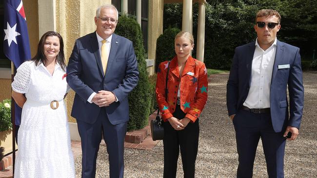 Prime Minister Scott Morrison and his wife Jenny with Grace Tame, who appeared to be uncomfortable with the meeting.