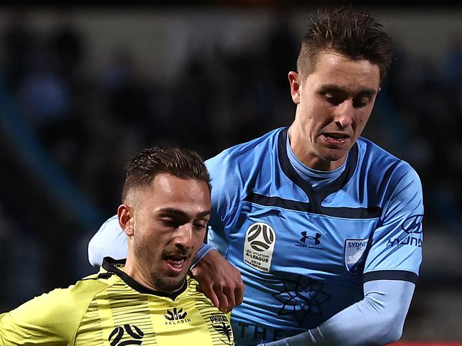 SYDNEY, AUSTRALIA - JULY 17: Reno Piscopo of the Phoenix is tacked by Joel King of Sydney FC  during the round 21 A-League match between Sydney FC and the Wellington Phoenix at Netstrata Jubilee Stadium on July 17, 2020 in Sydney, Australia. (Photo by Ryan Pierse/Getty Images)