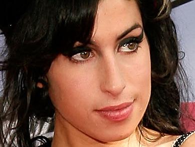 UNIVERSAL CITY, CA - JUNE 03: **6 MONTHS WEBSITE RIGHTS EMBARGO** Musician Amy Winehouse arrives to the 2007 MTV Movie Awards held at the Gibson Amphitheatre on June 3, 2007 in Universal City, California. (Photo by Vince Bucci/Getty Images for MTV)