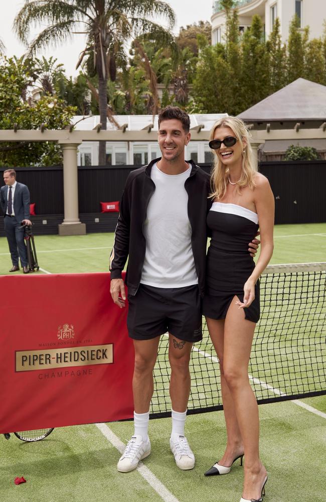 Thanasi Kokkinakis at a Piper Heidsieck party with Mary Vitinaros. Picture: Supplied