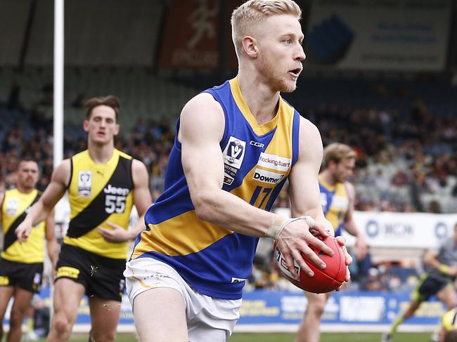 MELBOURNE, AUSTRALIA - SEPTEMBER 22: Jack Charleston of Williamstown runs with the ball during the VFL Grand Final match between the Richmond Tigers and Williamstown at Ikon Park on September 22, 2019 in Melbourne, Australia. (Photo by Daniel Pockett/Getty Images)