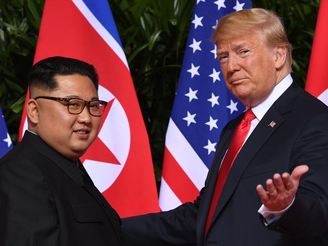 (FILES) In this file photo taken on June 12, 2018 US President Donald Trump (R) gestures as he meets with North Korea's leader Kim Jong Un (L) at the start of their historic US-North Korea summit, at the Capella Hotel on Sentosa island in Singapore. - Call Donald Trump an egomaniac, call him a showoff. Accuse him of getting kicks from insulting and humiliating people. The thing is, he might just agree. The uniqueness of the 45th US president among world leaders extends to the pride he takes in his brazenly unconventional persona. Trump doesn't just admit to a litany of character flaws and actions that would sink an ordinary politician. He revels in them. "The show is 'Trump' and it is sold-out performances everywhere. I've had fun doing it and will continue to have fun." On January 20, 2019, 72-year-old Trump reaches the halfway mark of his presidency's first term. (Photo by SAUL LOEB / AFP)