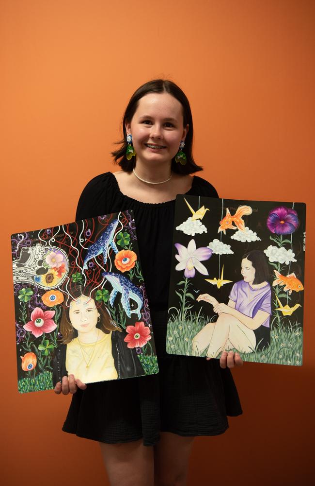 Darwin High School student Hayley Ryan holds their entrants for the Exit Art exhibition 2024. Picture: Georgina Campbell