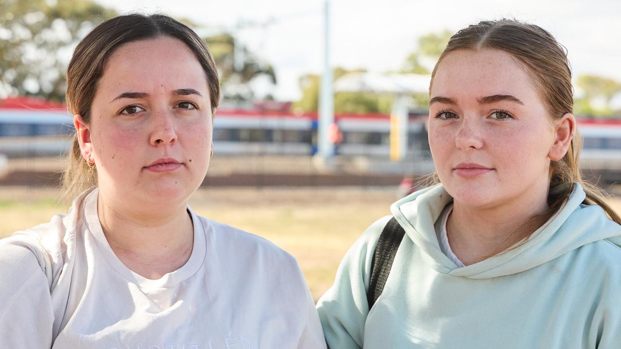 Morgan Taylor, 18, and Sophie Shepley, 18, at Tambelin train station in Evanston Gardens, after a child was hit by a train. Picture: Matt Loxton