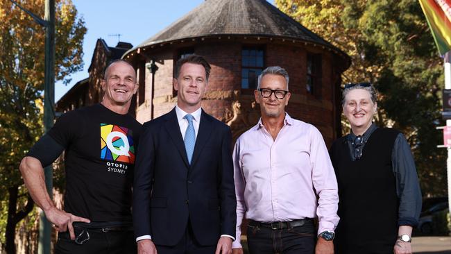 Qtopia supporters Ian Roberts, Premier Chris Minns, Greg Fisher and Dr Liz Bradshaw, outside the old Darlinghurst Police Station, which is the new home for Qtopia Sydney.