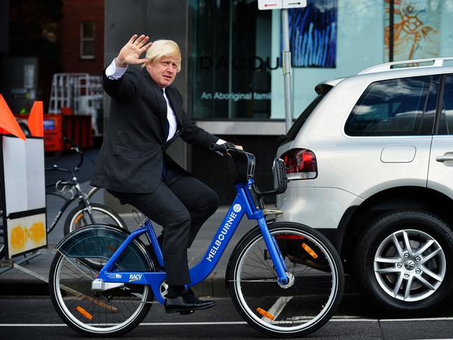 Then Mayor of London Boris Johnson in Melbourne in 2017 as a guest of that city’s writers festival. Pictured here taking a Melbourne bike for a ride in Spring Street.