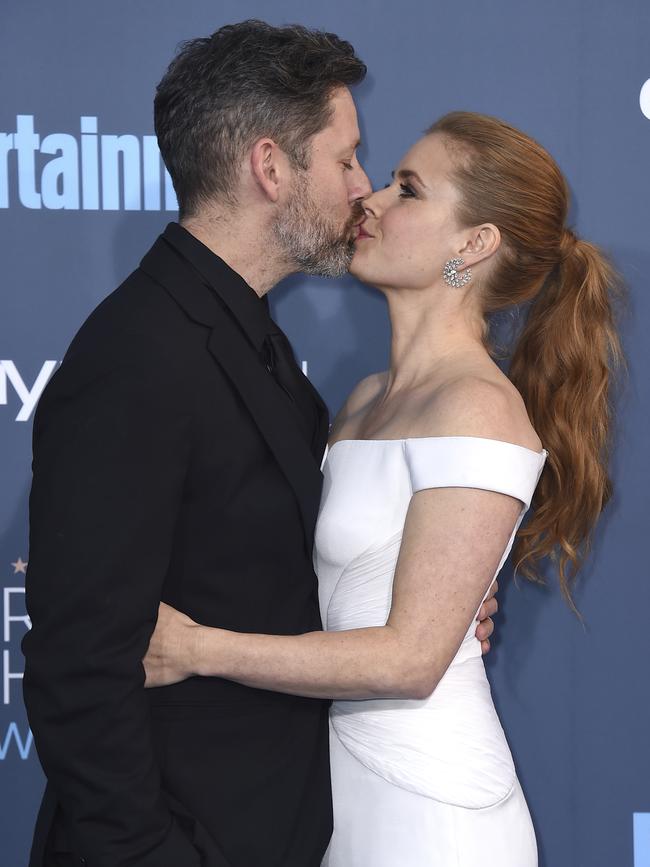 Amy Adams kisses her husband Darren Le Gallo at The 22nd Annual Critics’ Choice Awards at Barker Hangar on December 11, 2016 in Santa Monica, California. Picture: AP