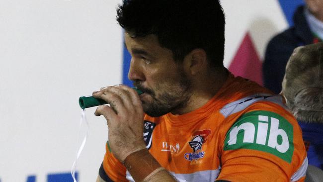 Aidan Guerra of the Knights  sucks on the green whistle as he is taken to have a possible broken leg assessed during the Round 5 NRL match between the Newcastle Knights and the Manly Sea Eagles at McDonald Jones Stadium in Newcastle, Saturday, April 13, 2019. (AAP Image/Darren Pateman) NO ARCHIVING, EDITORIAL USE ONLY