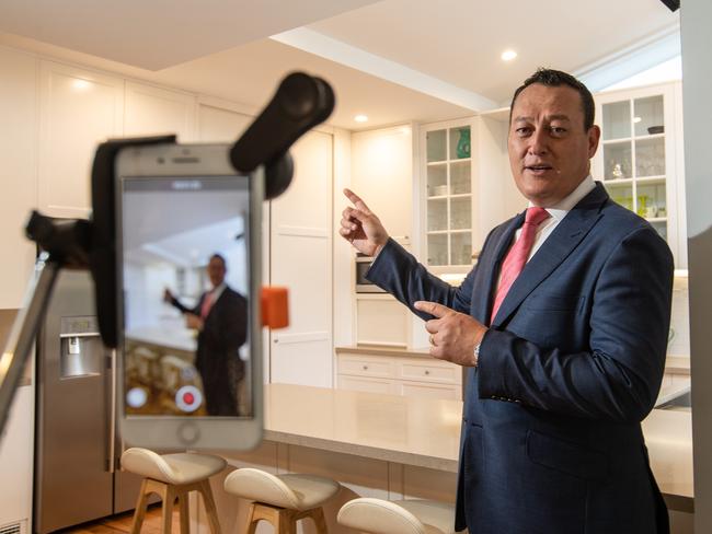 Tech savvy: agent John McManus, doing an open home inspection using virtual inspections on his Instagram account. Picture: AAP Image / Julian Andrews