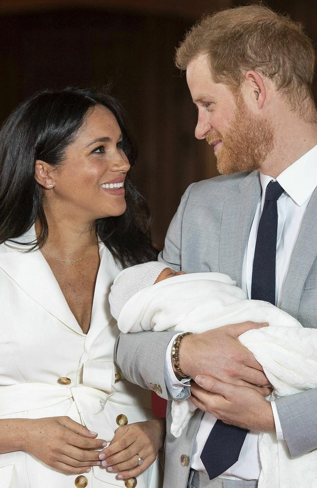 Prince Harry and Meghan show off their newborn son.