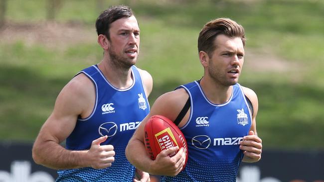 Todd Goldstein, left, runs with Shaun Higgins over summer.