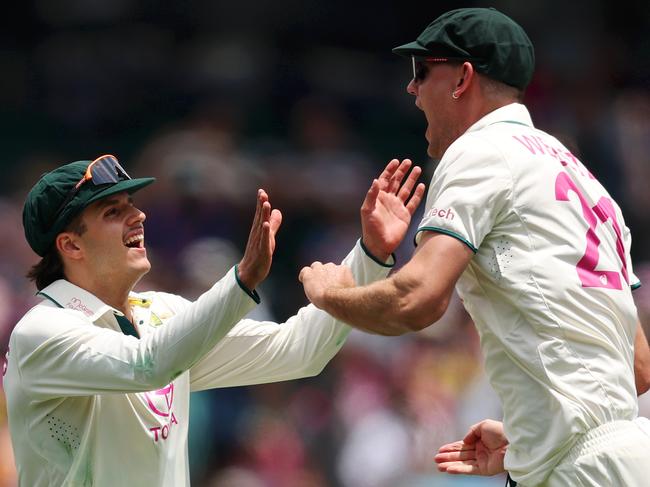 Beau Webster celebrates with Sam Konstas after catching Virat Kohli. Picture: Getty Images