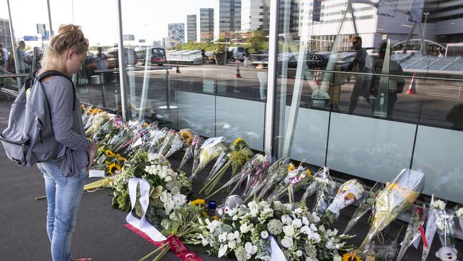 Grieving ... flowers at Ahiphol airport in Amsterdam where MH17 flew out from on July 17 last year. Picture: Ella Pellegrini