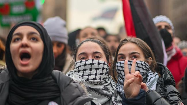 Protestor hold up a “peace” sign during a demonstration near Columbia University in NYC.