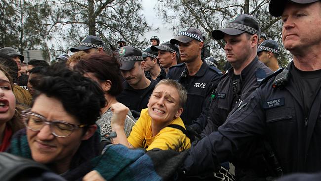 Protesters clash with police outside of the event. Picture: Danny Casey