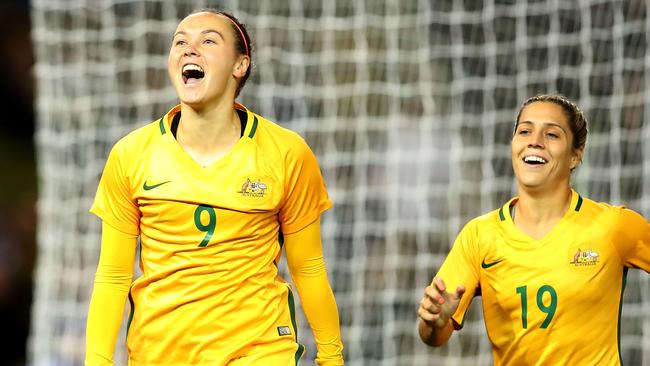 Caitlin Foord and Katrina Gorry celebrate scoring the opening goal against Brazil.