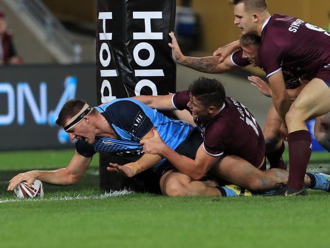 David Hollis scores for NSW during the Under 18 Origin game.