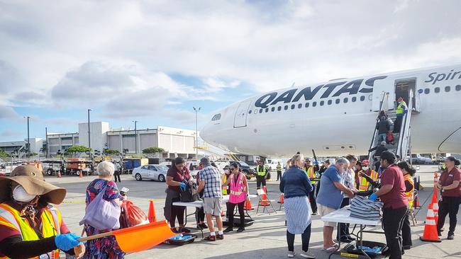 Boarding the charter flight … Picture: Tom Huntley