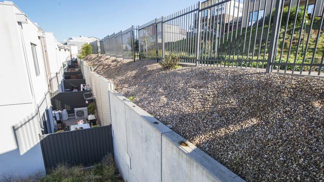 Many of the homes have high concrete walls behind them. Picture: Rob Leeson