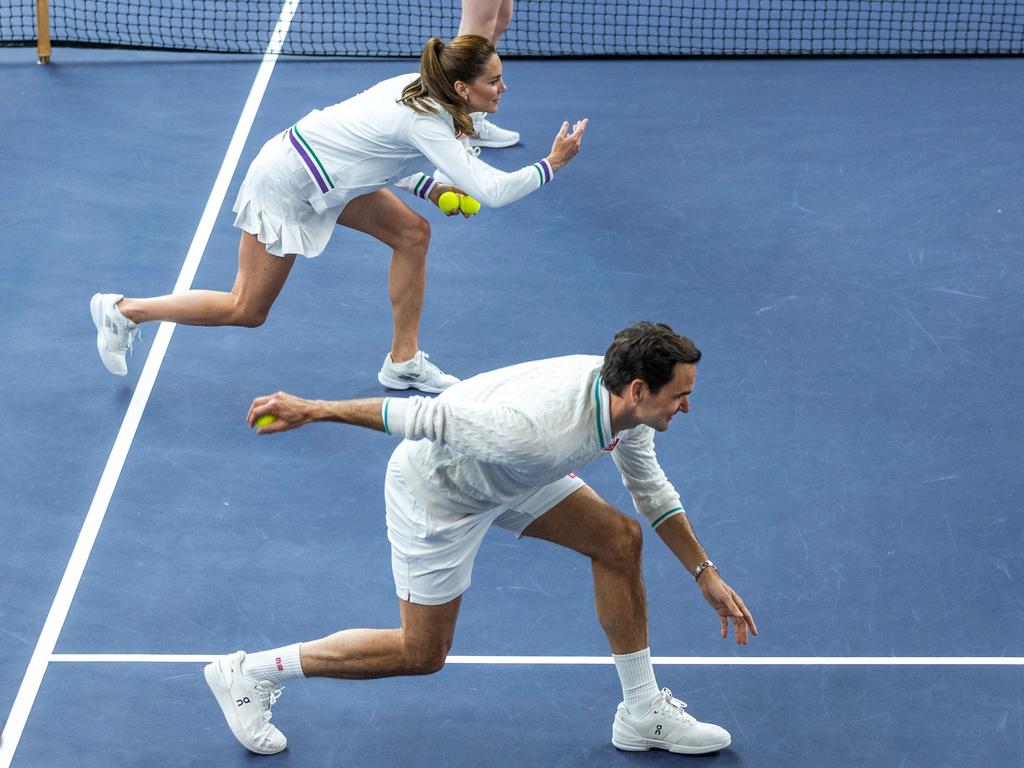 The pair take part in a warm up session at Wimbledon. Picture: AFP