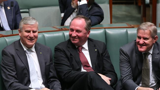 Nationals MP Michael McCormack, Nationals MP  Barnaby Joyce and Ian Macfarlane during a Division in the House of Representatives Chamber at Parliament House in Canberra.