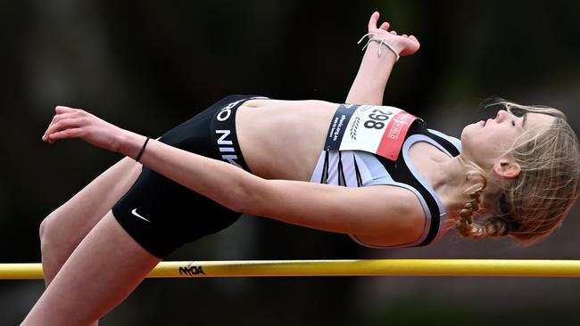 Eve Dziurek gets up and over in the high jump. Picture: Andy Brownbill