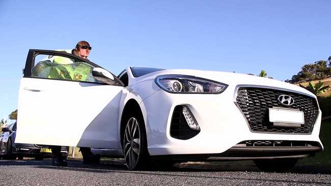 Officers from Coffs/Clarence Traffic and Highway Patrol following an alleged high speed pursuit which started at Glenugie and ended near the Big Banana at Coffs Harbour. Photo: Frank Redward