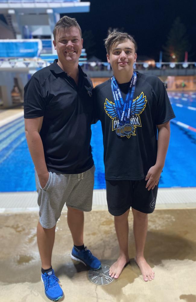 Flinders Phoenix swimming coach Chris Wright and Callum Simpson.