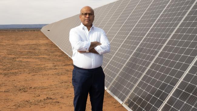 GFG Alliance executive chairman Sanjeev Gupta next to the Cultana solar plant test rig.