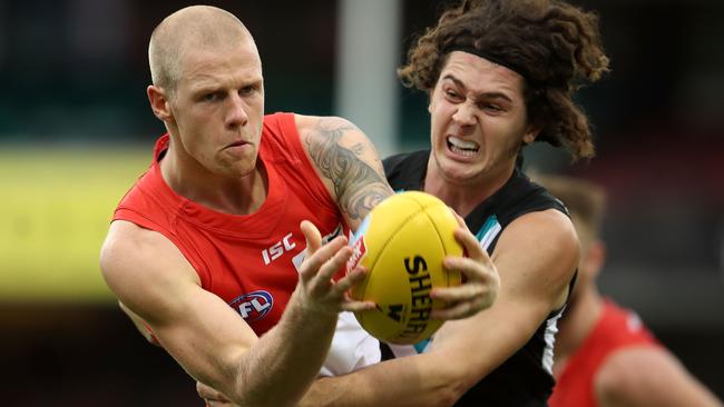 Zak Jones is tackled by Darcy Byrne-Jones during Round 1.