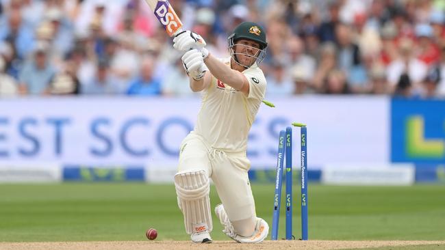 David Warner plays onto his stumps to be dismissed cheaply, again, by Stuart Broad. Picture: Getty