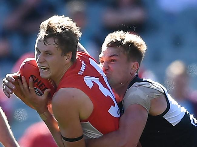 ADELAIDE, AUSTRALIA - AUGUST 29: Jordan Dawson of the Swans tackled by Ollie Wines of Port Adelaide bduring the round 14 AFL match between the Port Adelaide Power and the Sydney Swans at Adelaide Oval on August 29, 2020 in Adelaide, Australia. (Photo by Mark Brake/Getty Images)