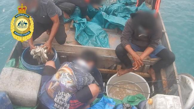 Illegal fishermen forced to throw their 3.2 tonnes of sea cucumber back into the sea. Picture: Supplied.