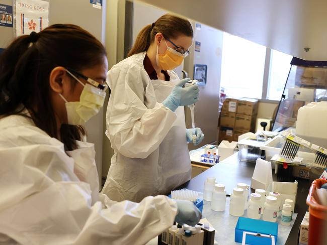 Scientists, Glenda Daza (L) and Emily Degli-Angeli (R) work on samples collected in the Novavax phase 3 vaccine trial at the UW Medicine Retrovirology Lab1 in Seattle. Picture: AFP.