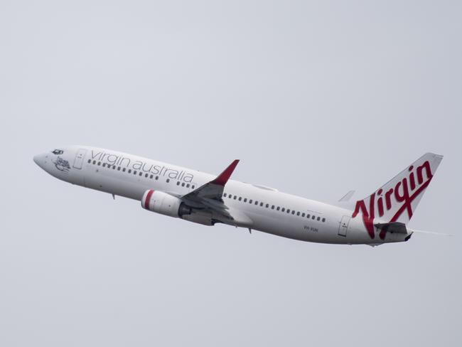 SYDNEY, AUSTRALIA - NewsWire Photos May 6, 2021: A Virgin Australia aircraft taking off at Sydney Airport.Picture: NCA NewsWire / James Gourley