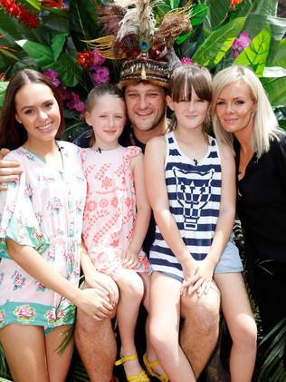 With his family after being crowned king of the jungle.